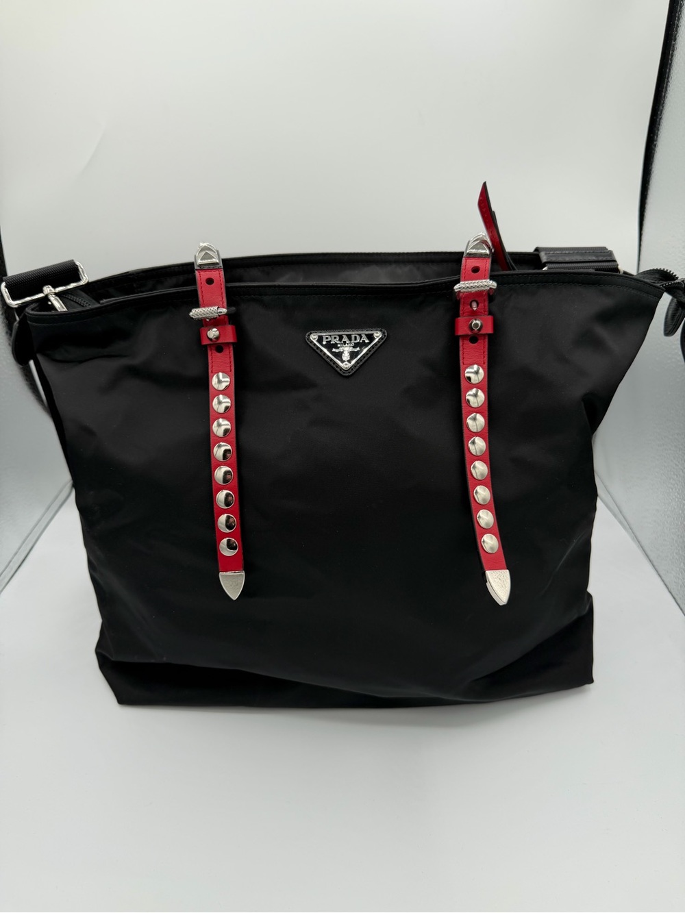 Prada Black Nylon Tote with Red Accent Straps and studded detailing